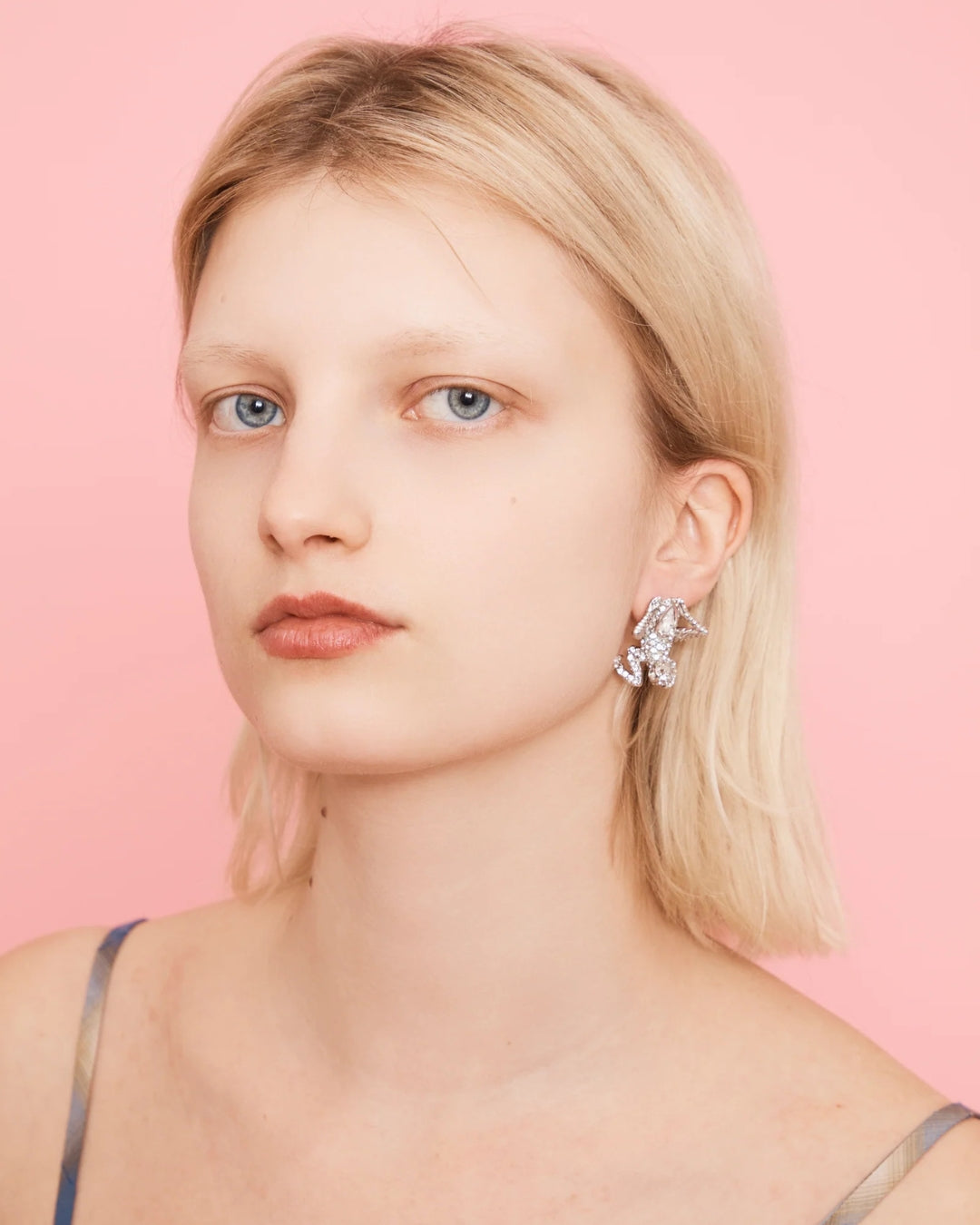 Collina Strada Mantis Earrings in Silver Clear — worn on ear for scale