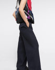 Colville AZ Factory Lucinda Chambers Molly Molloy, Double Wool Wide Leg Pants in Navy. Loose fitting boyfriend sit trouser pants. Crafted from navy blue wool in Italy. Shown on model facing to the side..