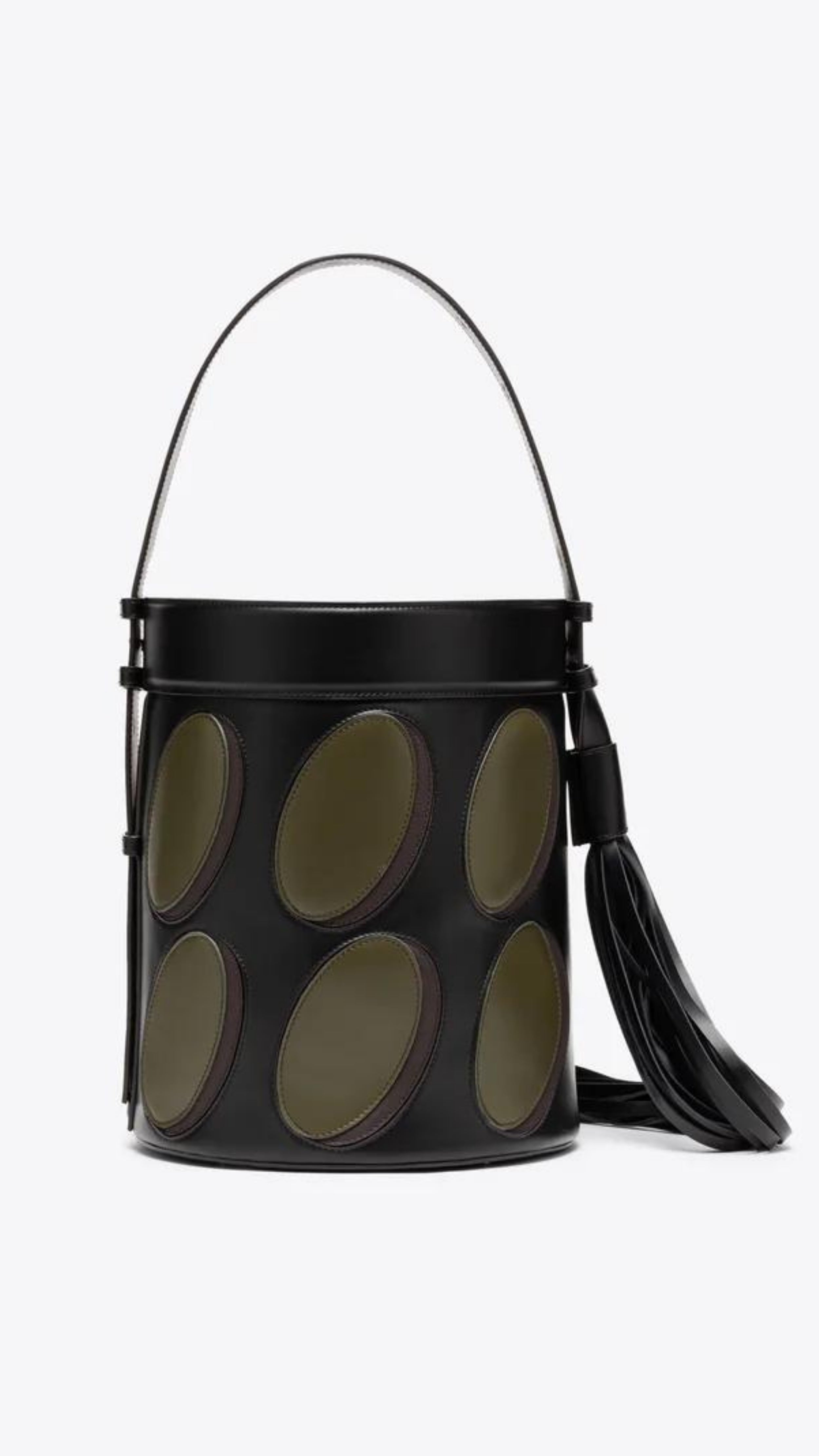 AZ Factory Colville Molly Molloy Lucinda Chambers,  Leather Patchwork Midi Bucket Bag.. Black oval bucket back in black leather with olive green ovals patches. Has an adjustable black handle and a dramatic oversize black leather tassel. Product shown from the back.