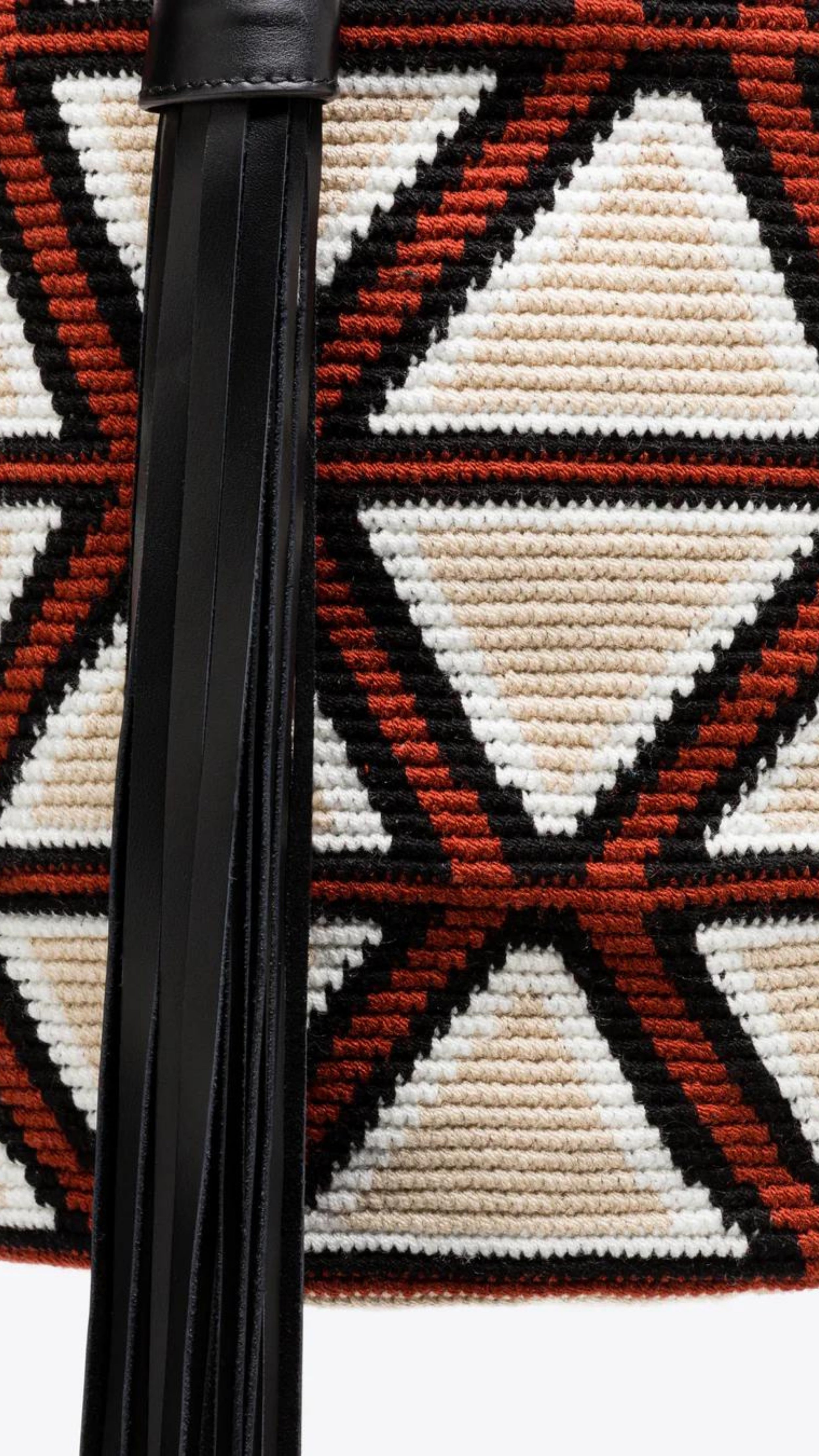 AZ Factory Colville Molly Molloy Lucinda Chambers, WOVEN CABRAS BAG  The Cabras Bag is woven in Wayuu Colombian and finished with Italian leather craftsmanship. Its ecru and burgundy diamond pattern is enhanced with black leather trim and a long black tassel. Detail of purse weaving and tassel