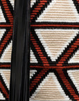 AZ Factory Colville Molly Molloy Lucinda Chambers, WOVEN CABRAS BAG  The Cabras Bag is woven in Wayuu Colombian and finished with Italian leather craftsmanship. Its ecru and burgundy diamond pattern is enhanced with black leather trim and a long black tassel. Detail of purse weaving and tassel