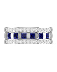 Conde de diamante Azura Ring. 18K white gold band ring with a center row of carré cut blue sapphires flanked on each side by bands of pave white diamonds. Product photo showing ring from front