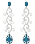 Conde de diamante Eden Earrings. 18K white gold drop earrings  Featuring a London Blue Topaz stud and tendrils of white gold with pave white diamonds and a second London Blue Topz Drop at the bottom. Product photo from the front