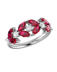 Conde de diamante Marquise Ring. 18K white gold, diamond and ruby band ring. Five single diamonds are flanked by eight oval cut rubies. Shown from the front.