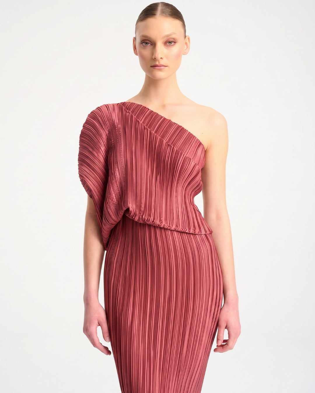 Daphne Valente Polyhumnia Dress in Pomegranate — front close-up showing draped one-shoulder bodice