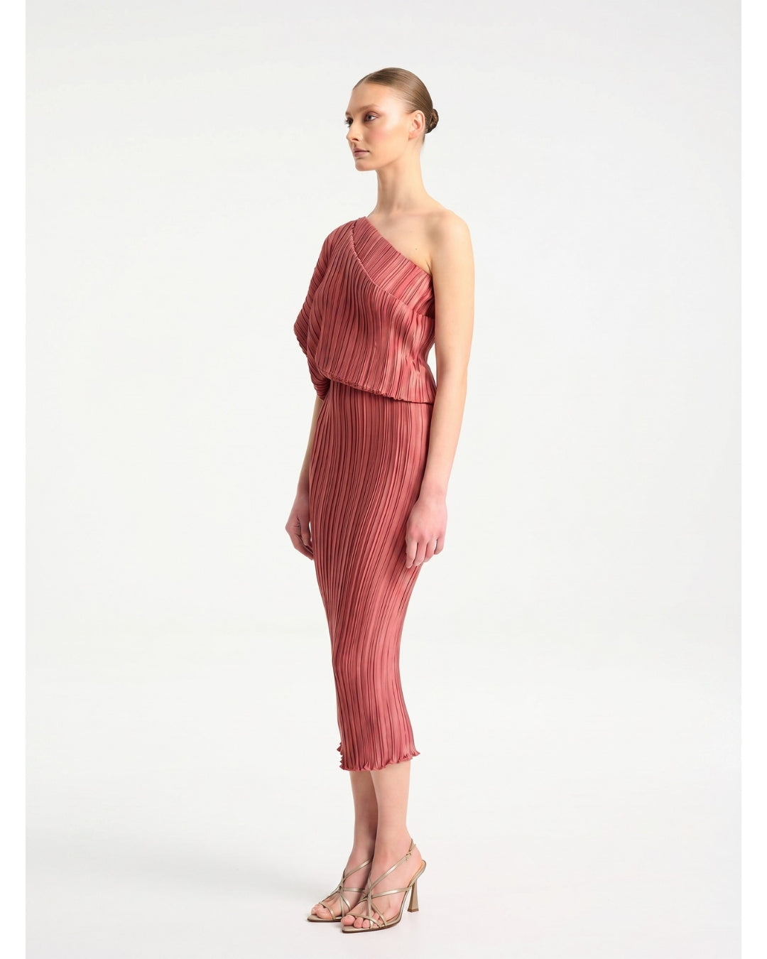 Daphne Valente Polyhumnia Dress in Pomegranate — side view showing shoulder drape detail


