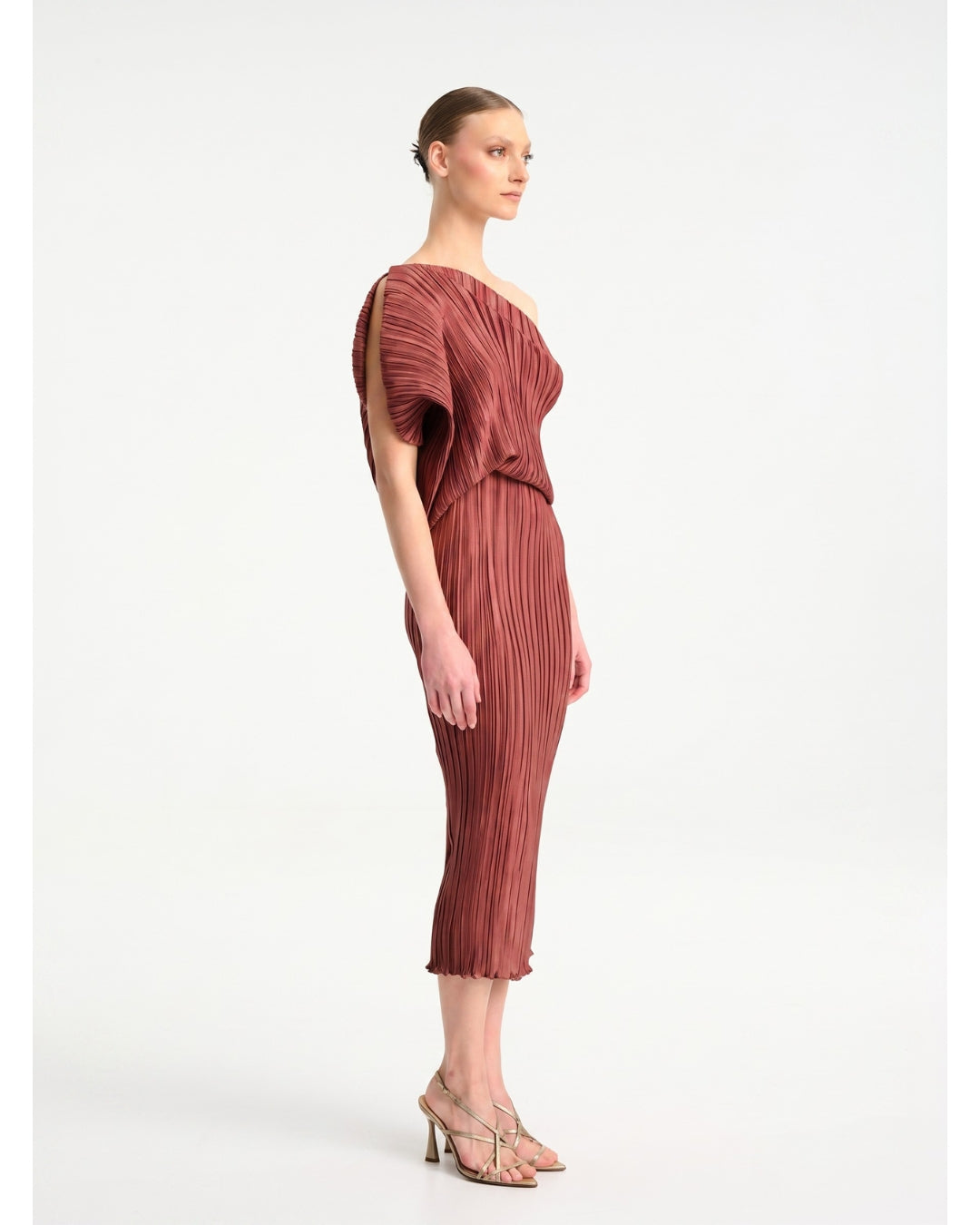 Daphne Valente Polyhumnia Dress in Pomegranate — side view showing figure-hugging silhouette
