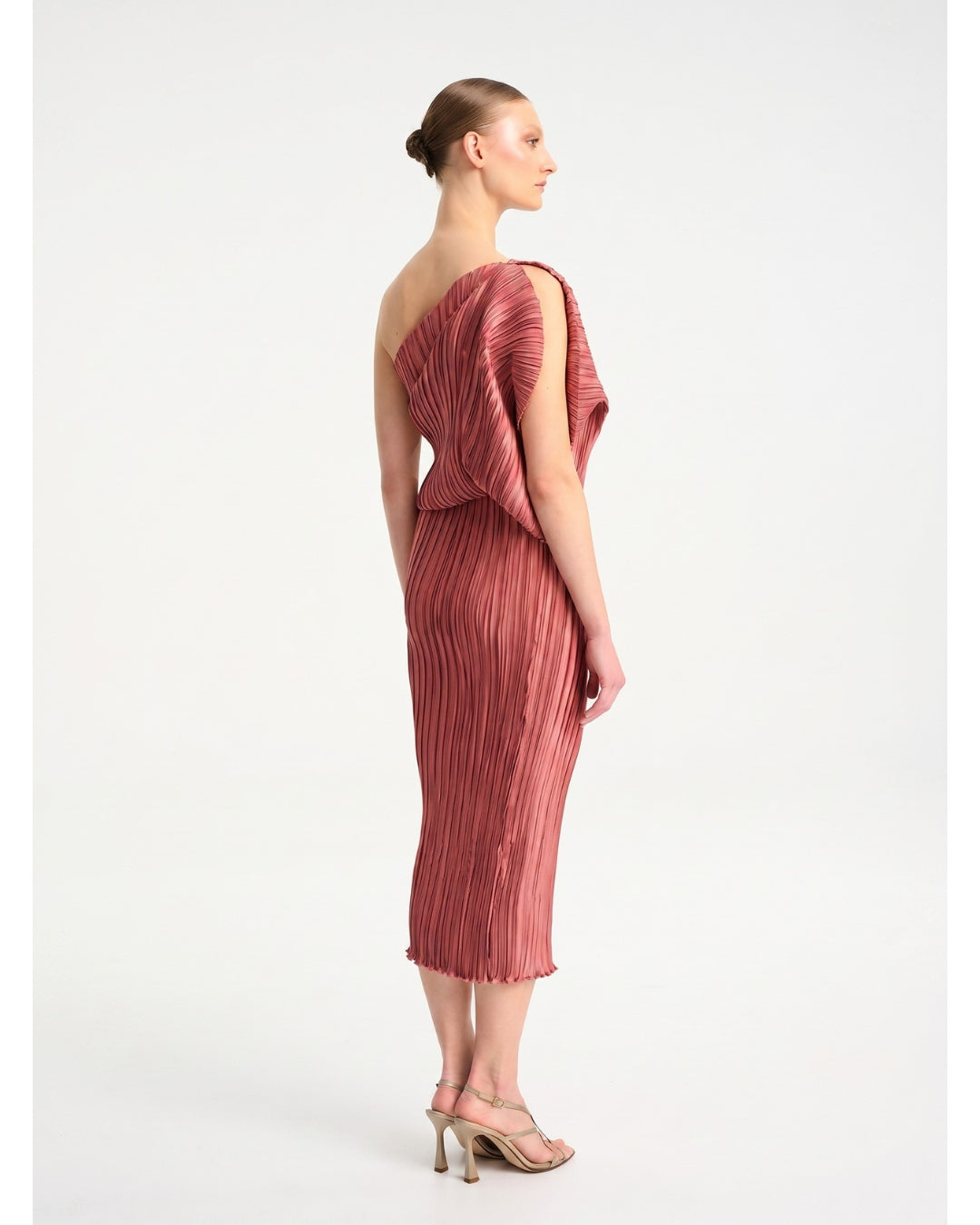 Daphne Valente Polyhumnia Dress in Pomegranate — back view showing pleating and fit

