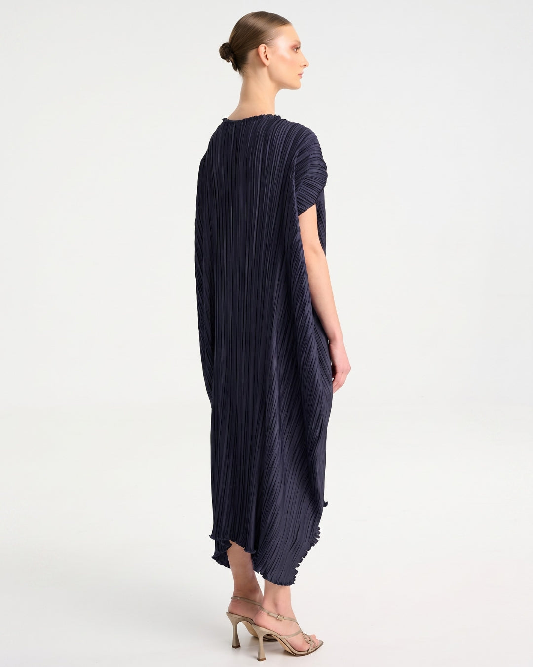 Daphne Valente Esthis Kaftan in Ink — back view showing pleating and hem
