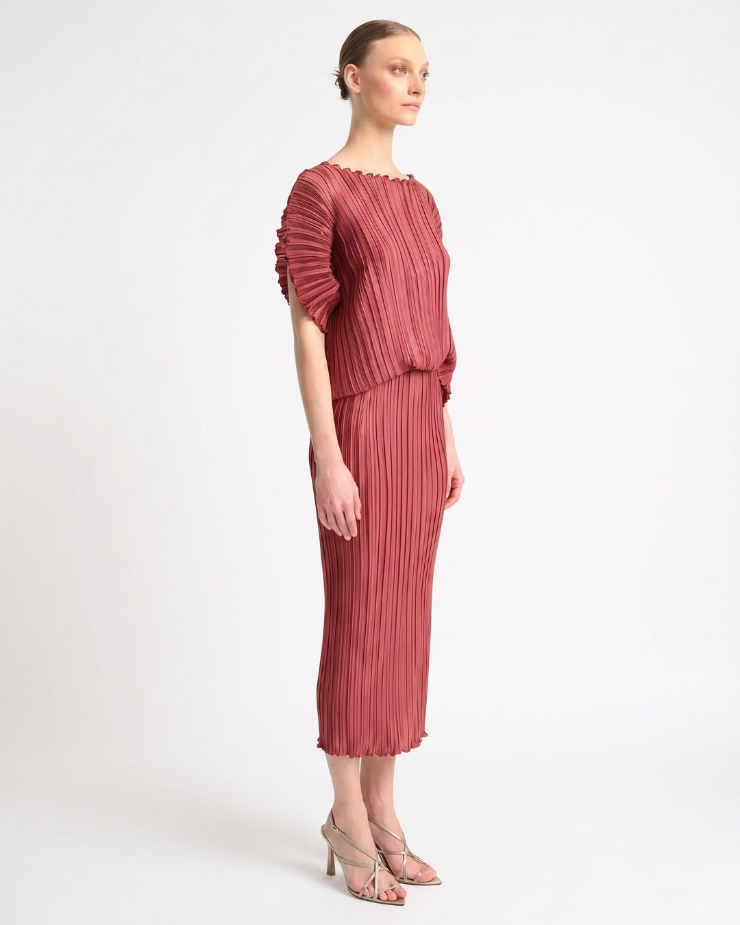 Daphne Valente Magnet Dress in Pomegranate — side view showing bouffant sleeve and slim skirt