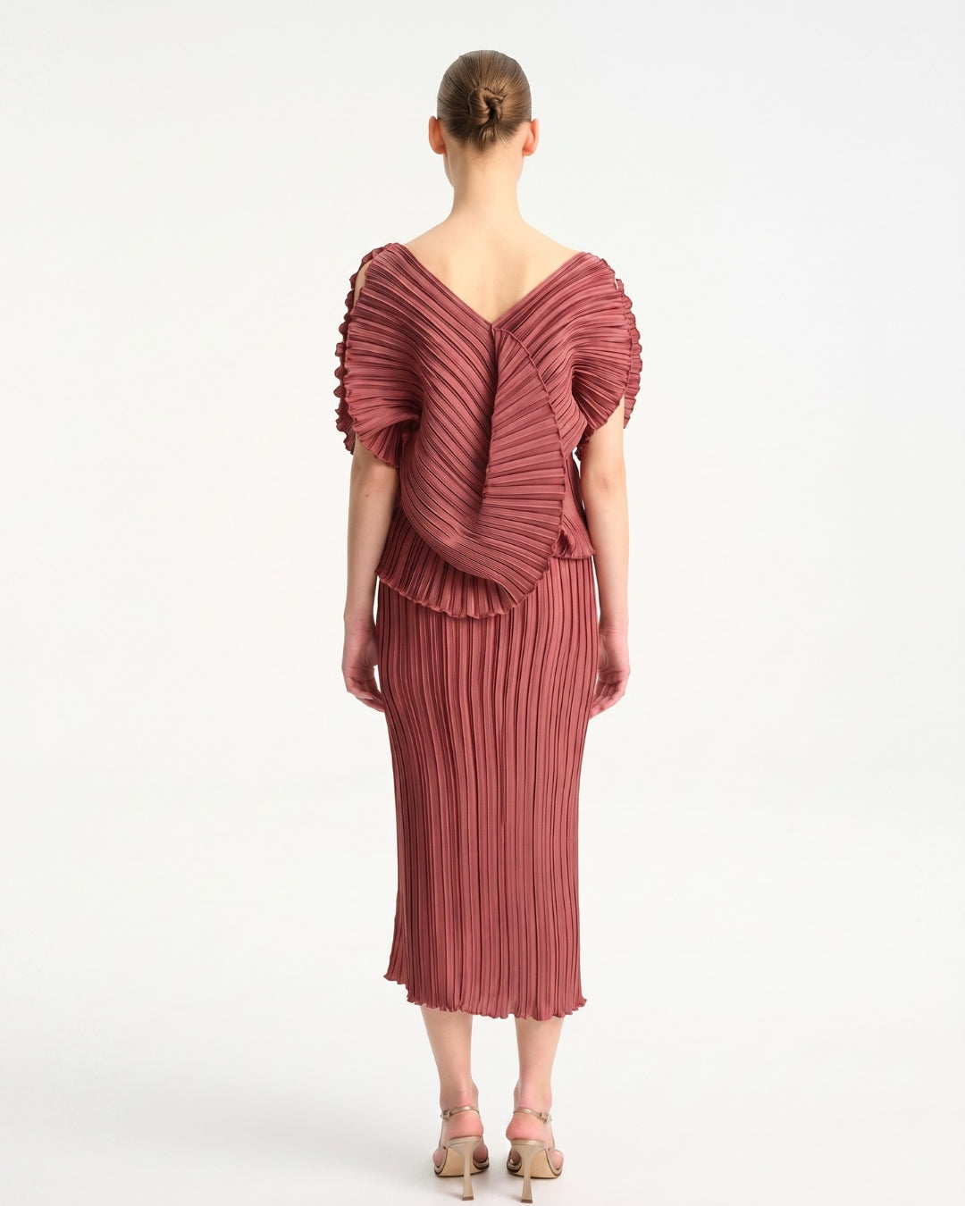 Daphne Valente Magnet Dress in Pomegranate — back view showing dramatic ruffled drape