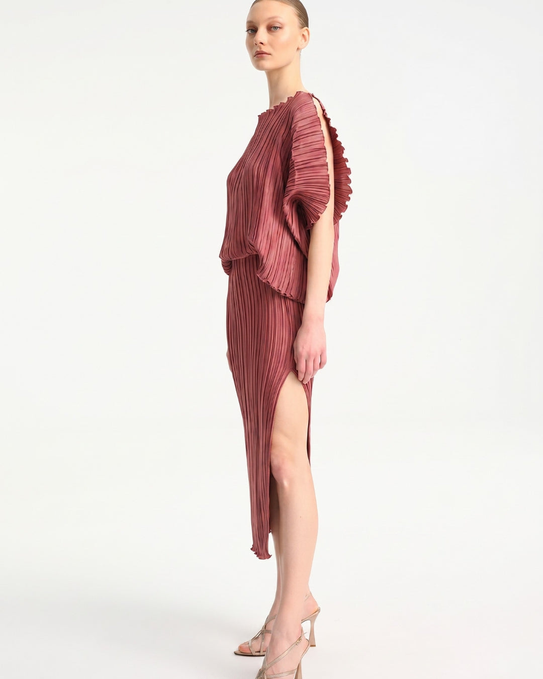 Daphne Valente Magnet Dress in Pomegranate — side profile showing leg slit and silhouette