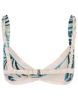 For Restless Sleepers Aglaia Silk Bralette. 100% silk summer silk top in white patterned with shades of blue and green palm leaves. Elastic straps and hook closures in the back. Back product photo.