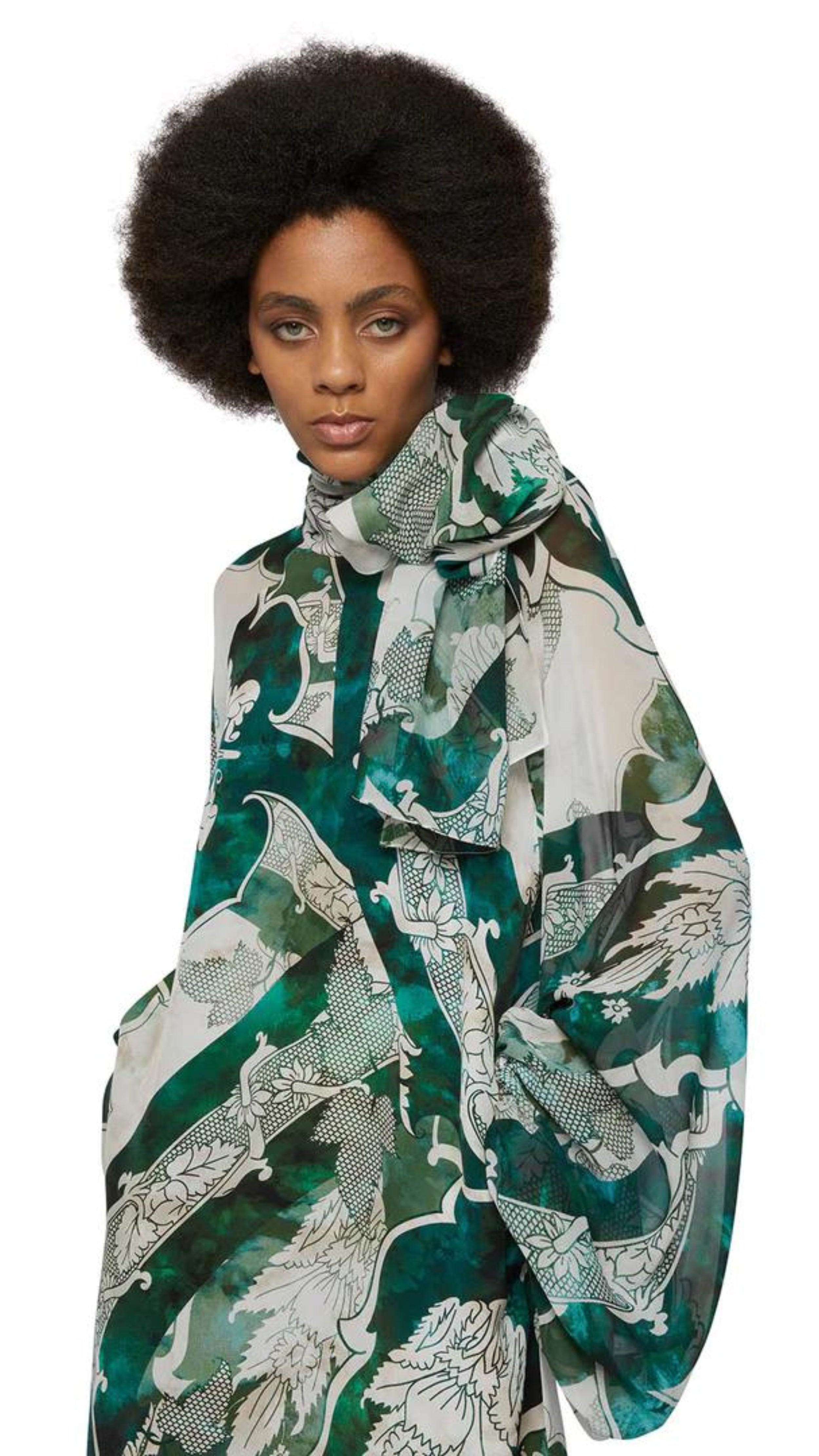 For Restless Sleepers Arpocrate Silk Dress. With dramatic oversized raglan sleeves and neck scarf. Long dress in green and ivory. Shown on model facing forward close up of top detail.