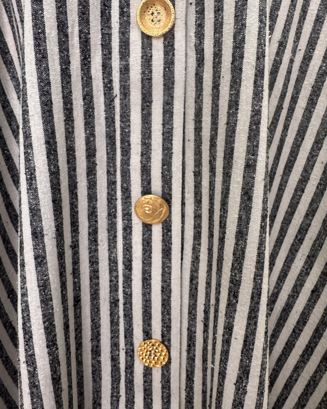 Close-up of vintage upcycled gold buttons on Françoise Maia Skirt