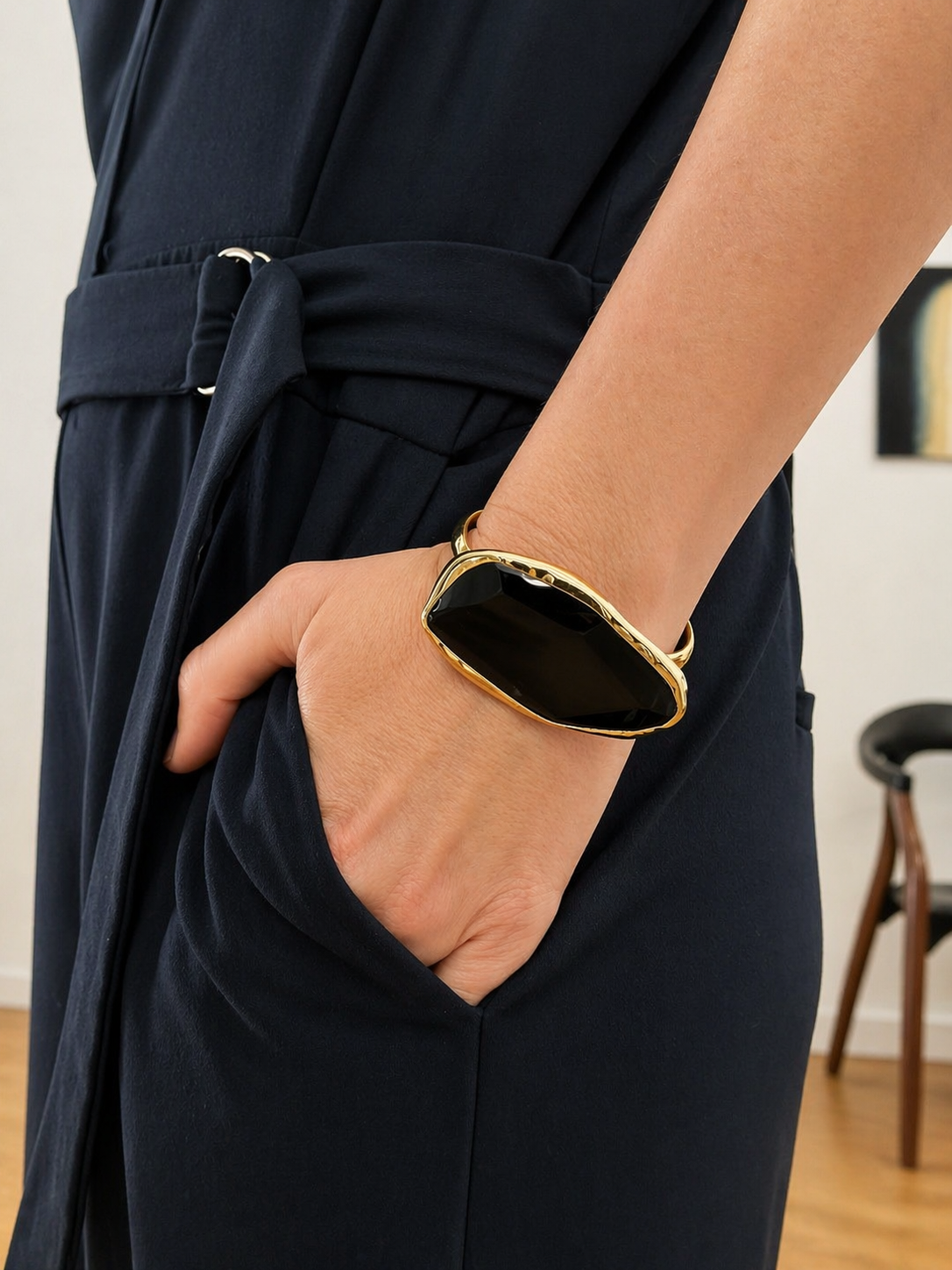 Françoise x Gas Bijoux Aura Bracelet worn on wrist with navy outfit, showing scale of stone and cuff width