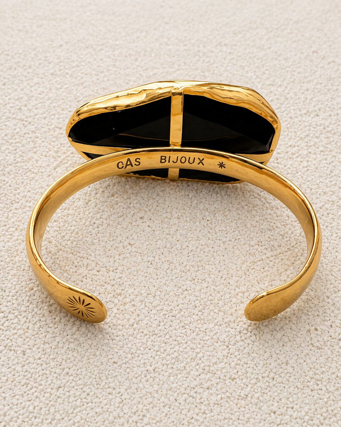 Gas Bijoux engraved interior of Aura Bracelet cuff showing brand signature and starburst detail