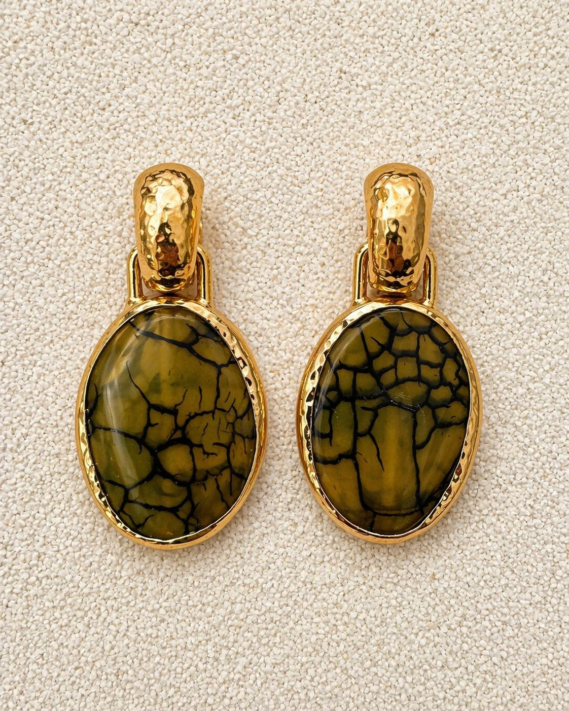 Françoise x Gas Bijoux Aura Earrings front view showing olive and black crackled mineral glass stones in hammered gold bezels
