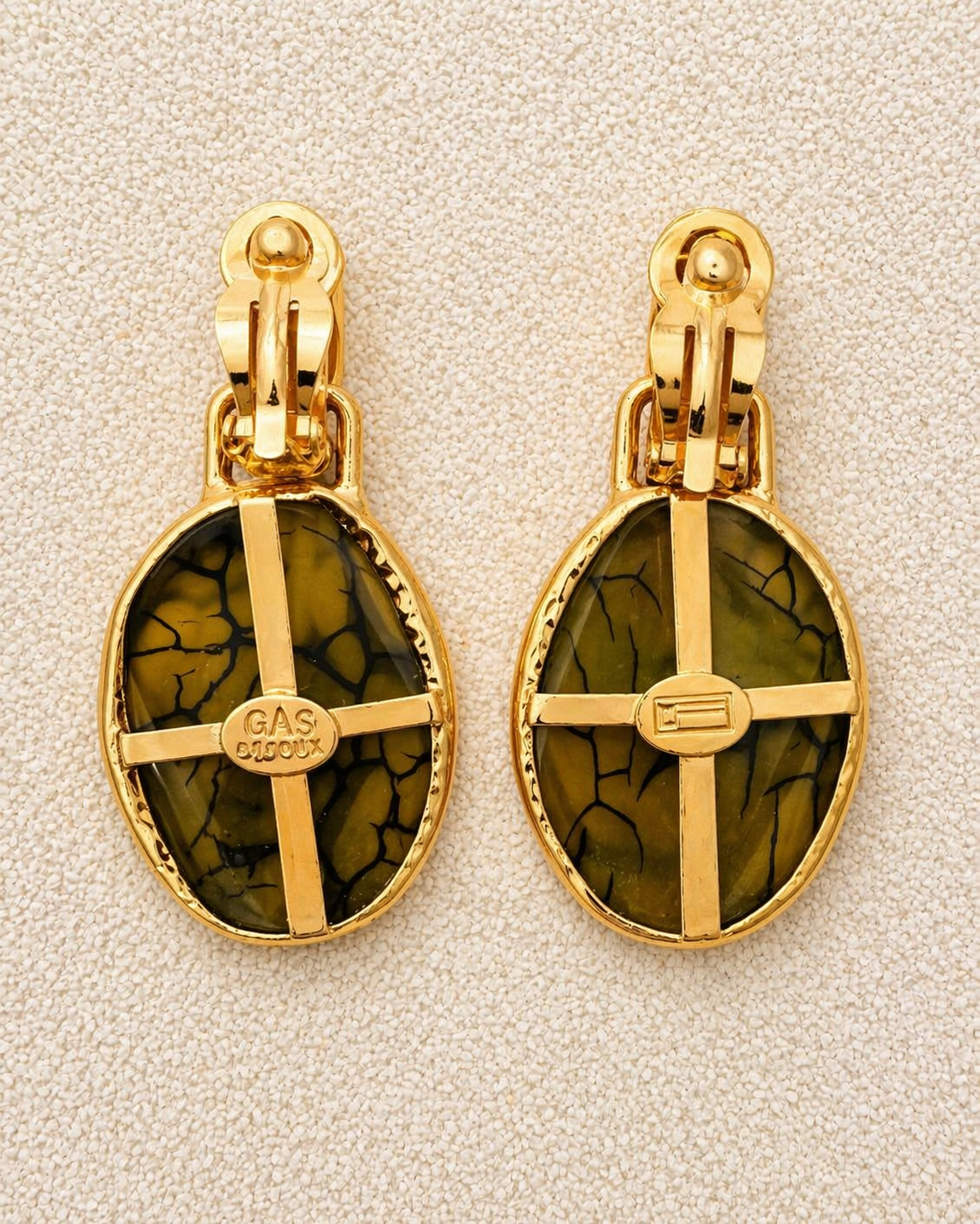  Aura Earrings flat lay showing reverse of both earrings with clip fastening and hammered gold backs