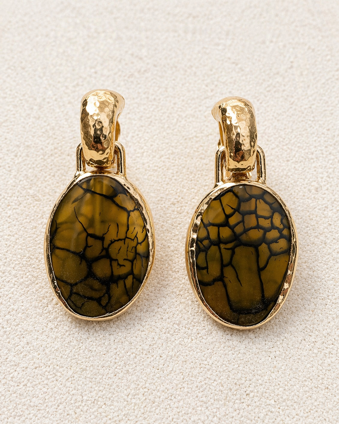 Françoise x Gas Bijoux Aura Earrings front view close-up showing crackled olive mineral glass texture and hammered gold bezel