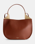 Ree Projects Helen Hobo in Cognac Soft Calf. Medium sized hobo style tote bag made from super soft italian leather. sustainably made in a cognac color. Shown from the front view.