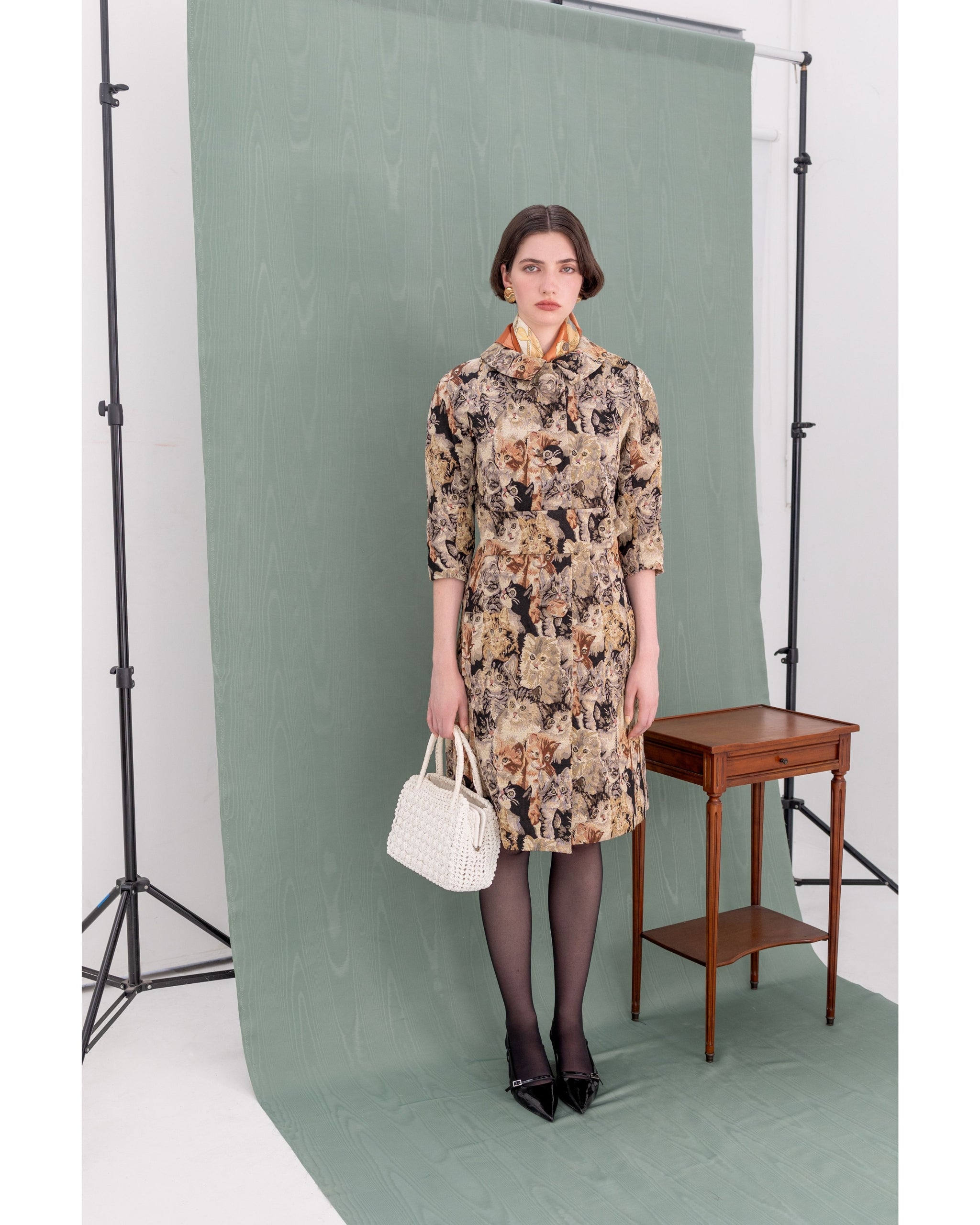 Model wearing A-line jacquard Cat Coat by Henri Paris, front view