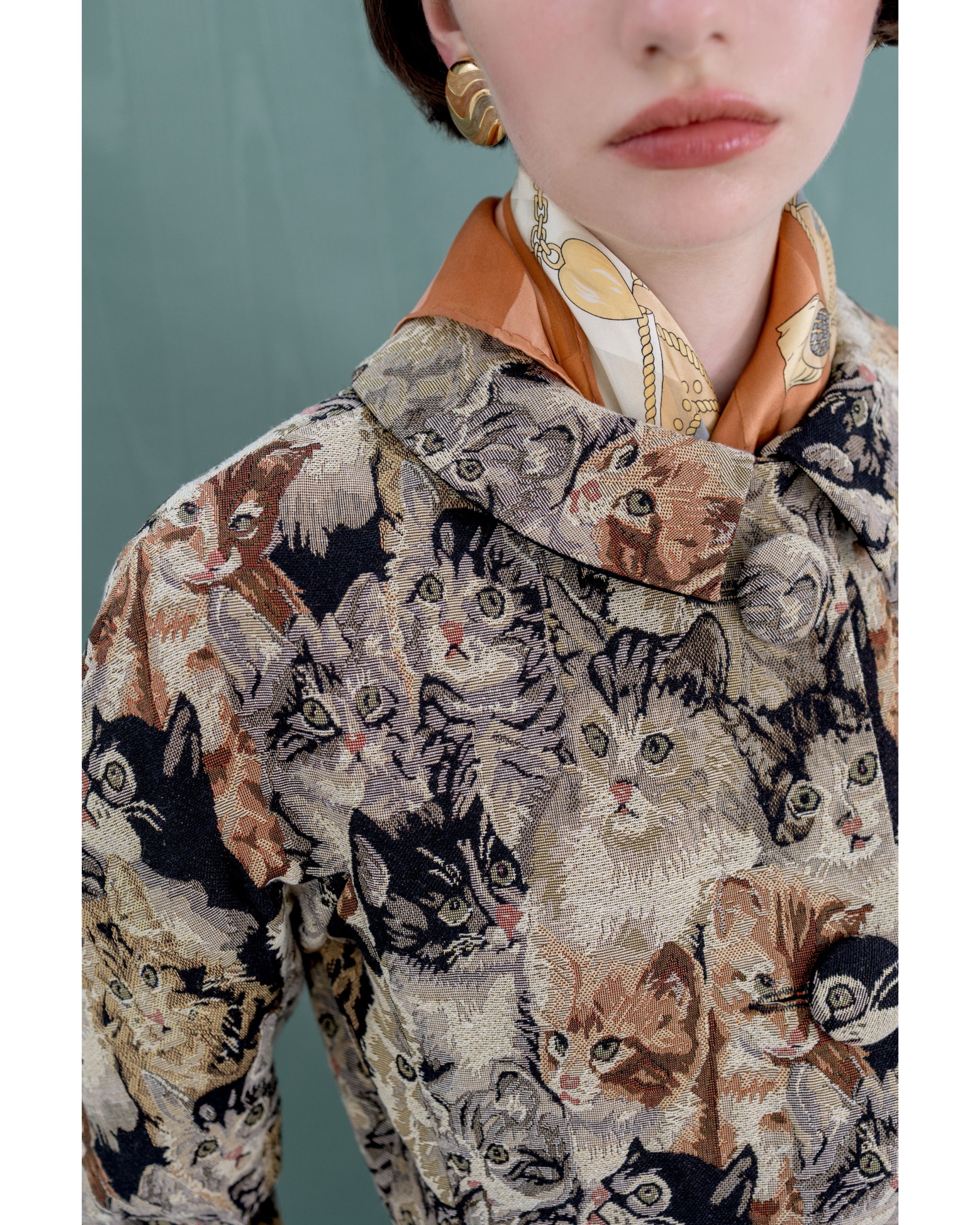 Close-up of cat jacquard fabric and covered buttons on Henri Paris Cat Coat
