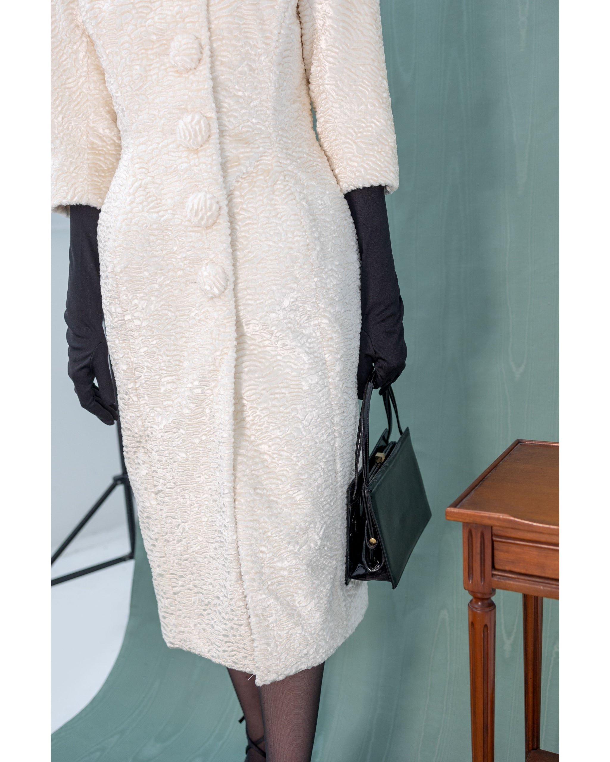 Henri Paris faux astrakhan coat — close-up of textured fabric and covered buttons