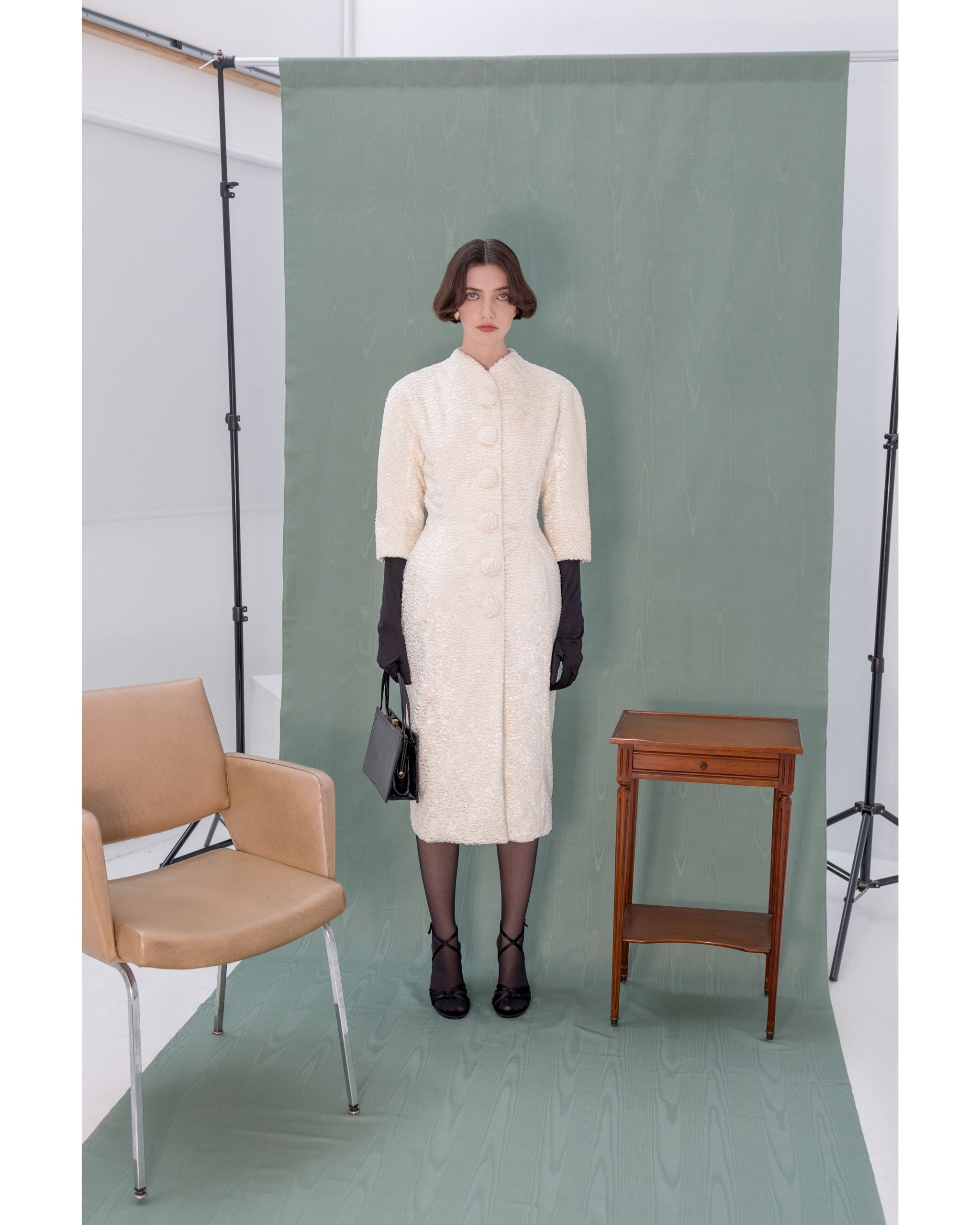 Henri Paris faux astrakhan coat — model wearing coat, full look