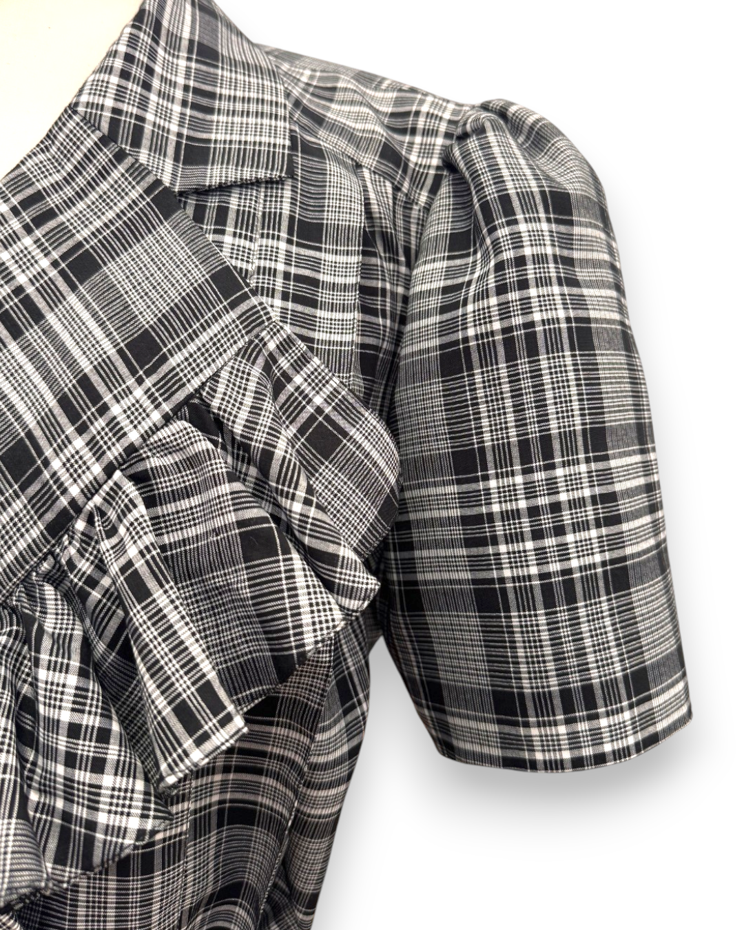 Henri Paris, Checked Double-Breasted Midi Dress with Ruffle Bib, close-up of structured organza-lined puff sleeve in black and white check, Experience 27