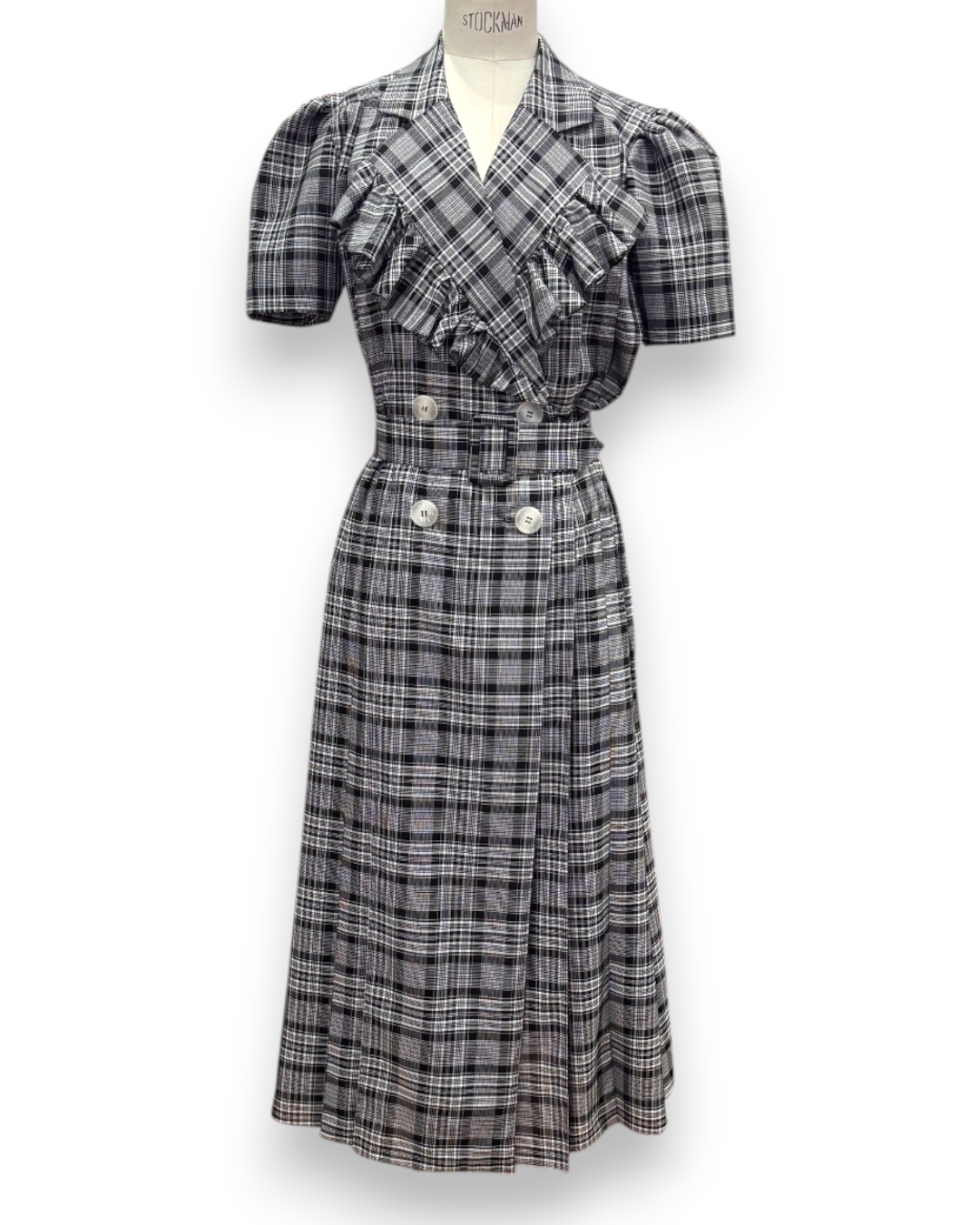 Henri Paris, Checked Double-Breasted Midi Dress with Ruffle Bib, full-length front view on mannequin showing ruffle bib and double-breasted buttons, Experience 27