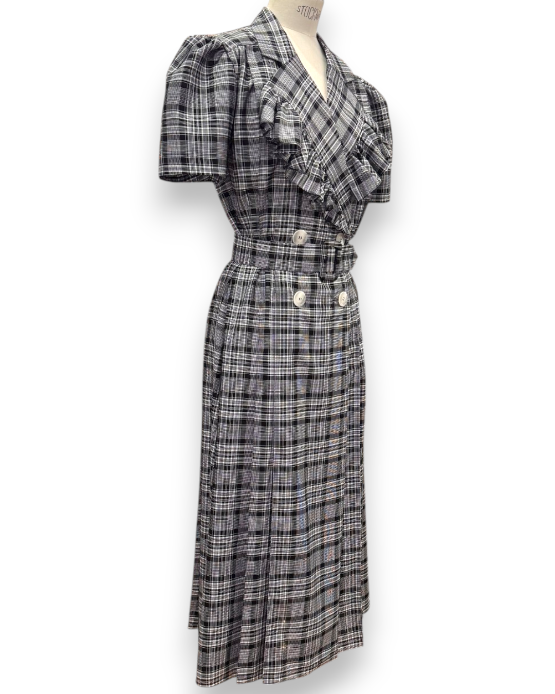 Henri Paris, Checked Double-Breasted Midi Dress with Ruffle Bib, three-quarter front view showing ruffle bib, puff sleeves and gathered midi skirt, Experience 27