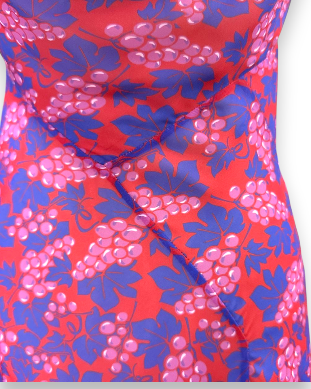 Henri Paris, Floor Length Grape Print Mousseline Gown, close-up of bias-cut bodice with grape and vine print in red, purple and pink, Experience 27