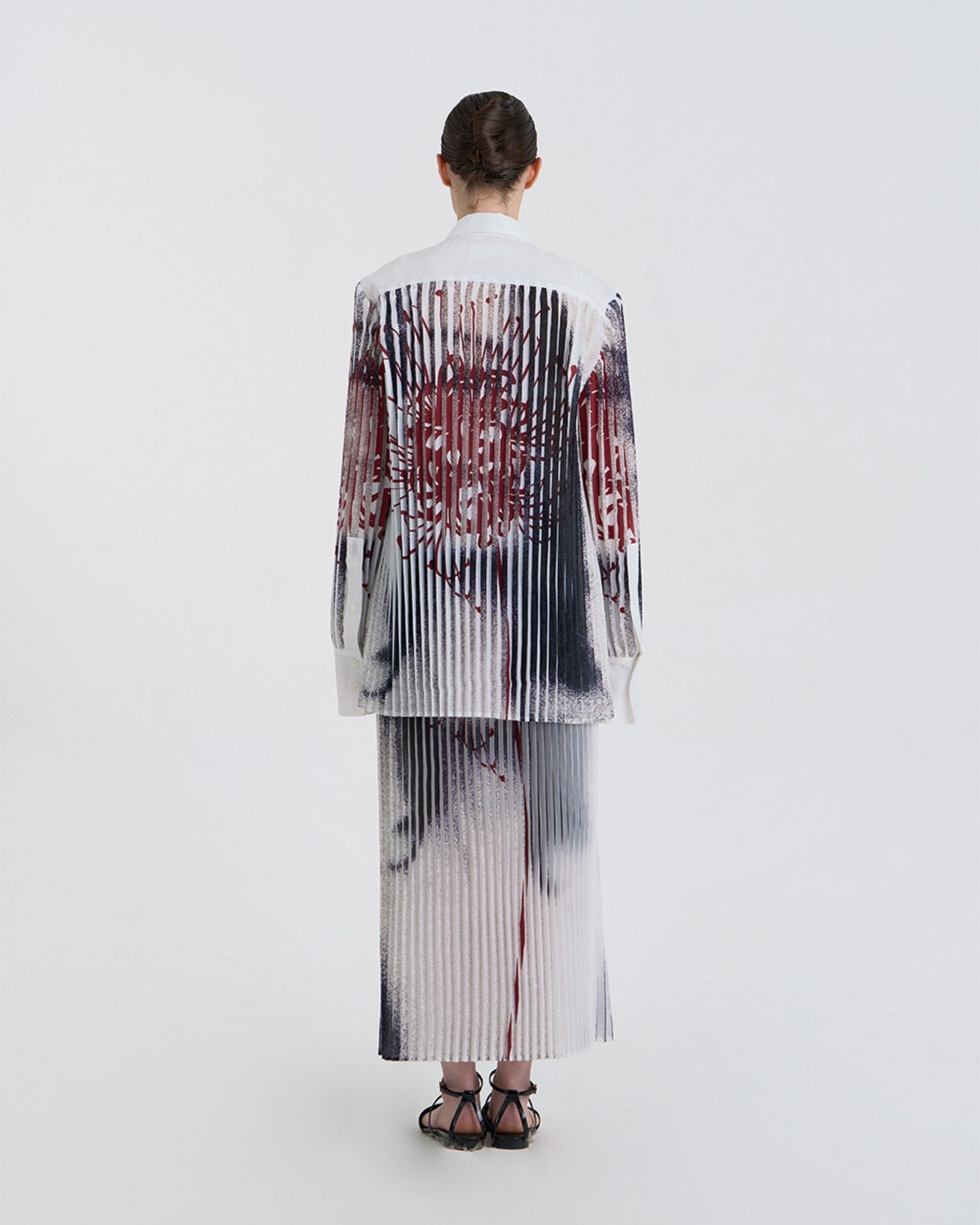 Back view of JINSUN Anamo Printed Shirt displaying full pleated abstract print