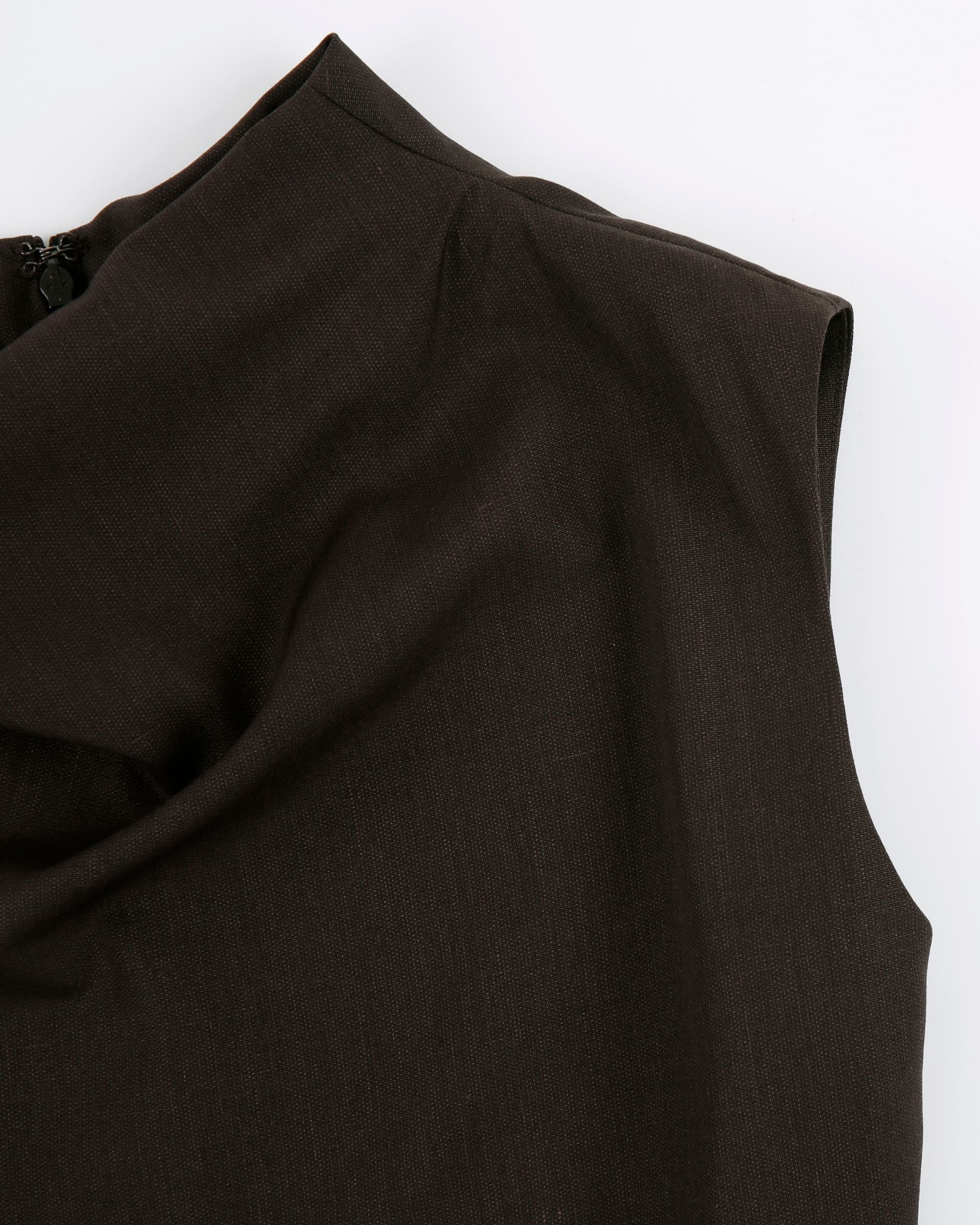 Close-up of JINSUN Filante Wool Jumpsuit fabric texture and neckline drape