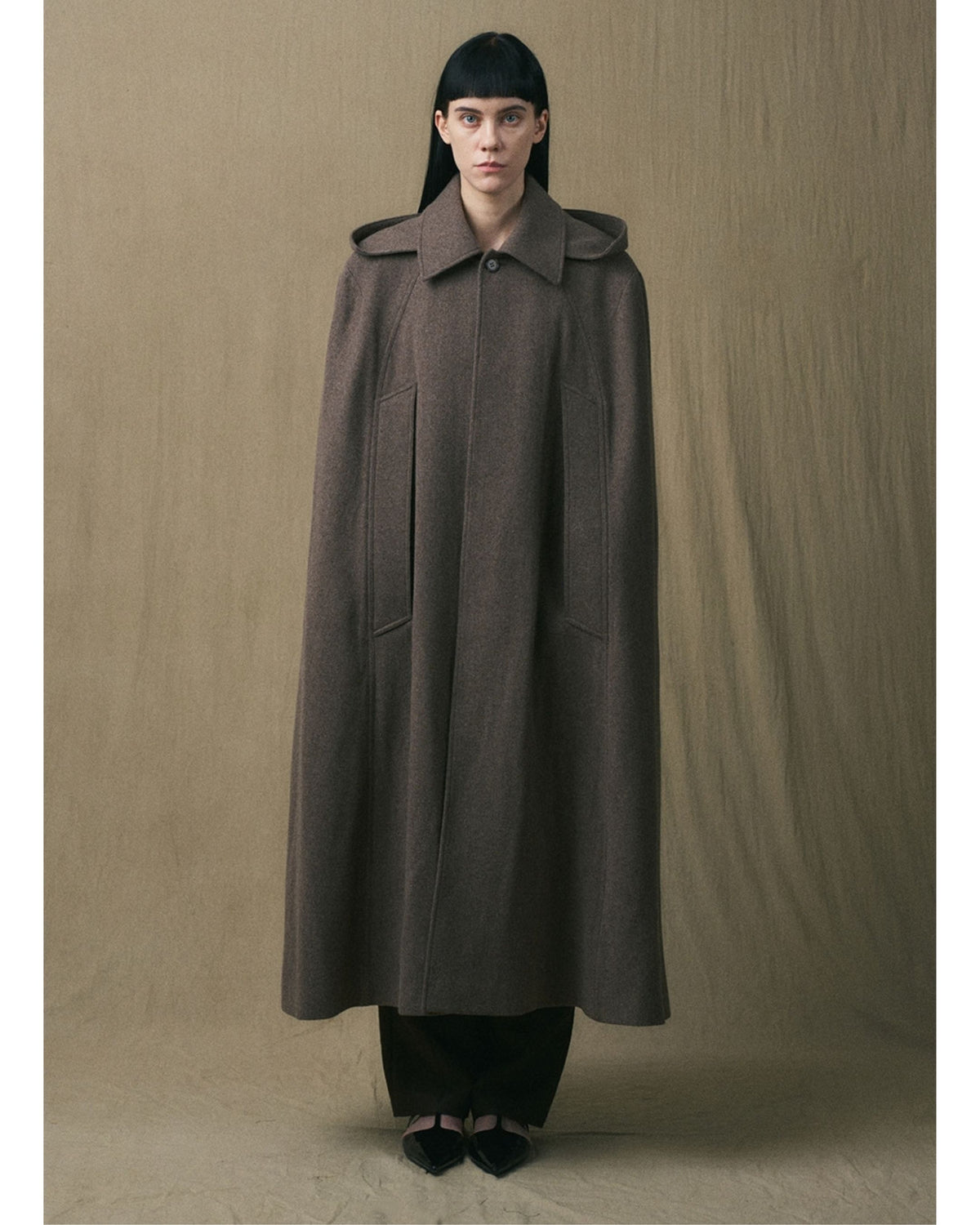 Full-length front view of the brown JINSUN wool cape coat