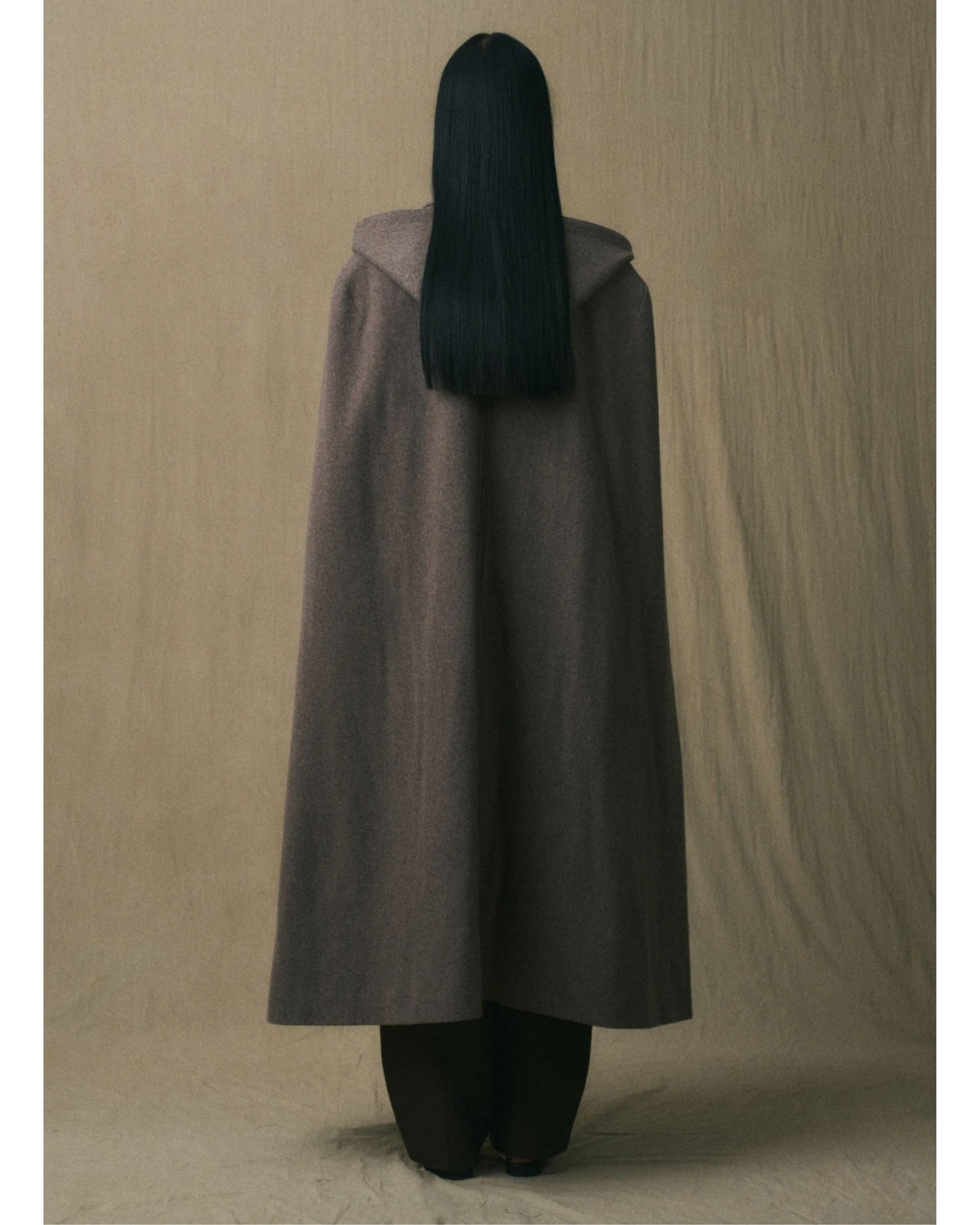 Back view of the JINSUN Long Wool Cape Coat in brown
