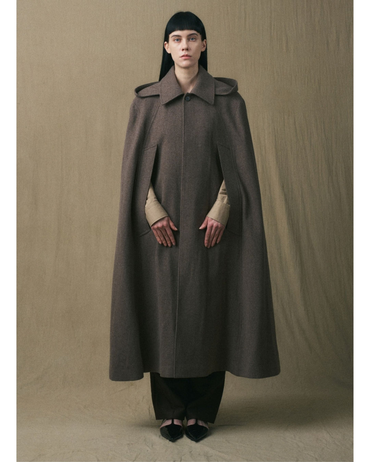 JINSUN brown wool cape coat with sweeping oversized silhouette