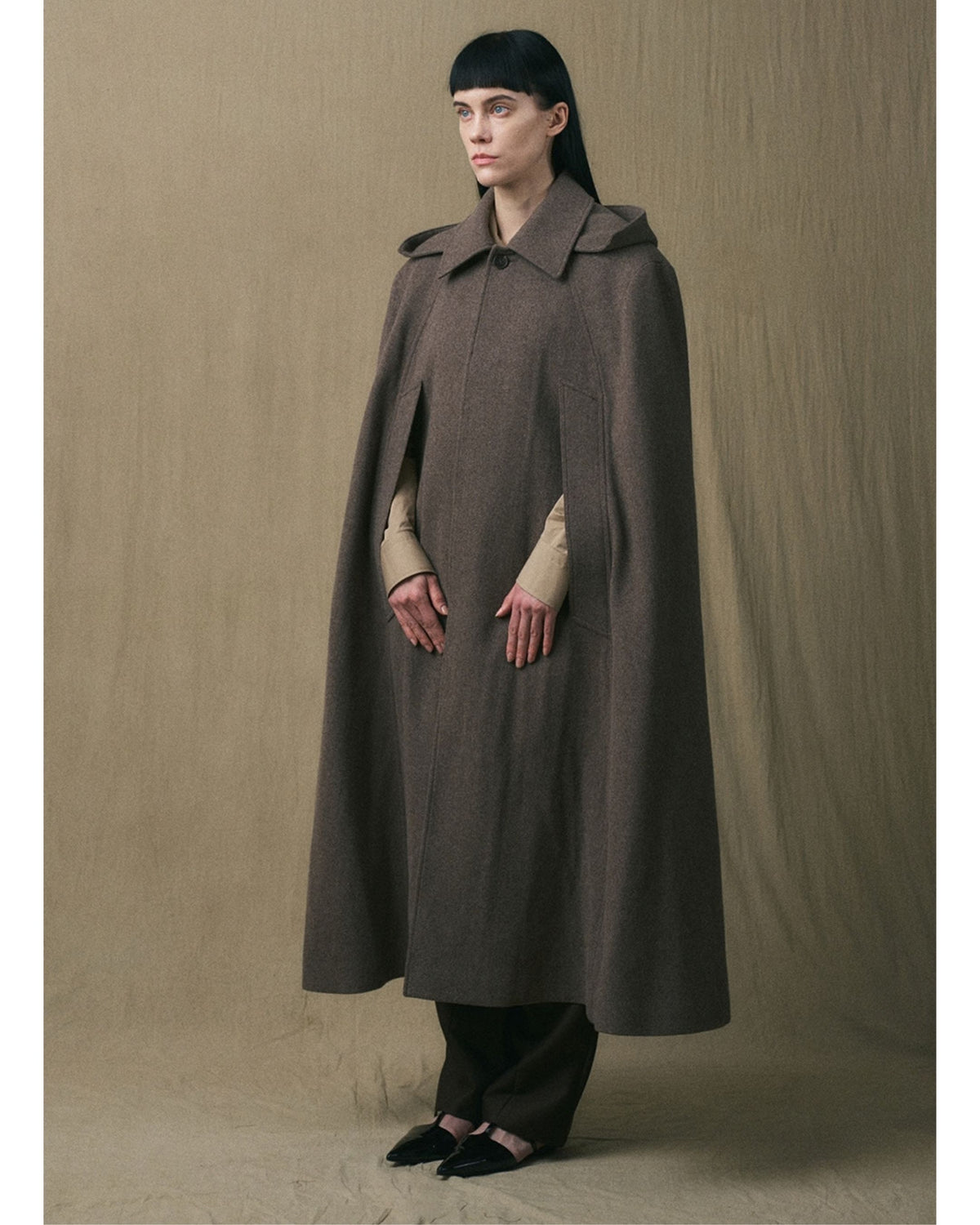 JINSUN Long Wool Cape Coat in brown, three-quarter view