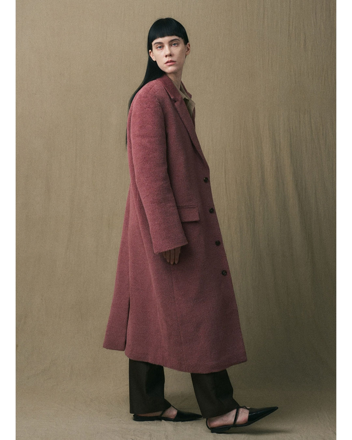 Side view of the JINSUN full-length Suri alpaca coat
