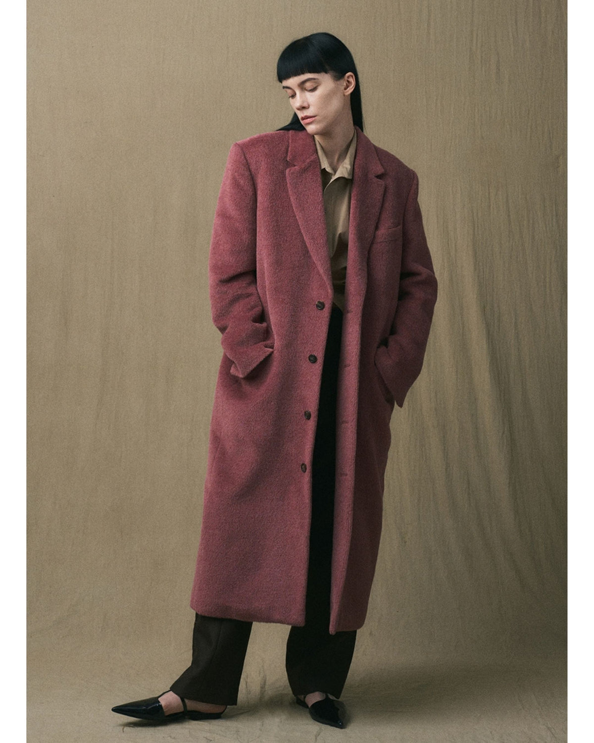 JINSUN oversized alpaca coat in muted rose with hands in pockets