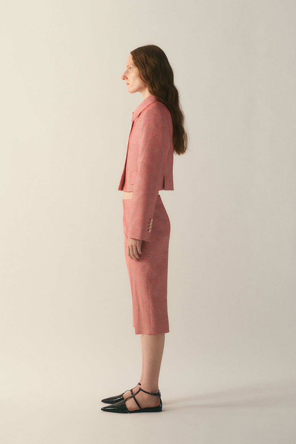 Side view of the Veyra Wool Silk Jacket highlighting cropped length

