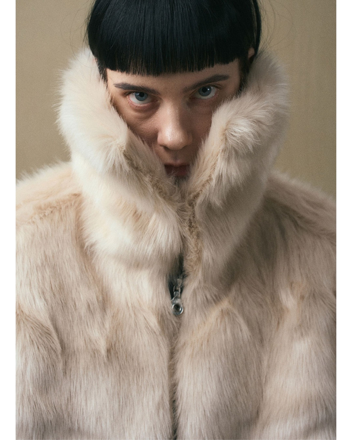 Close-up of the oversized hood on the JINSUN Shearling Cape Blouson