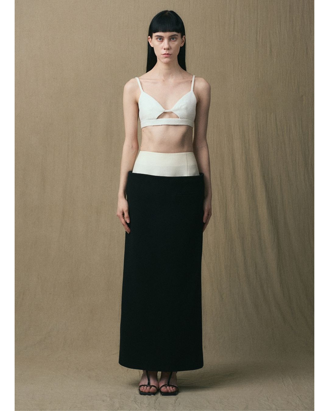 Front view of the JINSUN Tuxedo Maxi Pencil Skirt in black with a contrasting ivory waistband