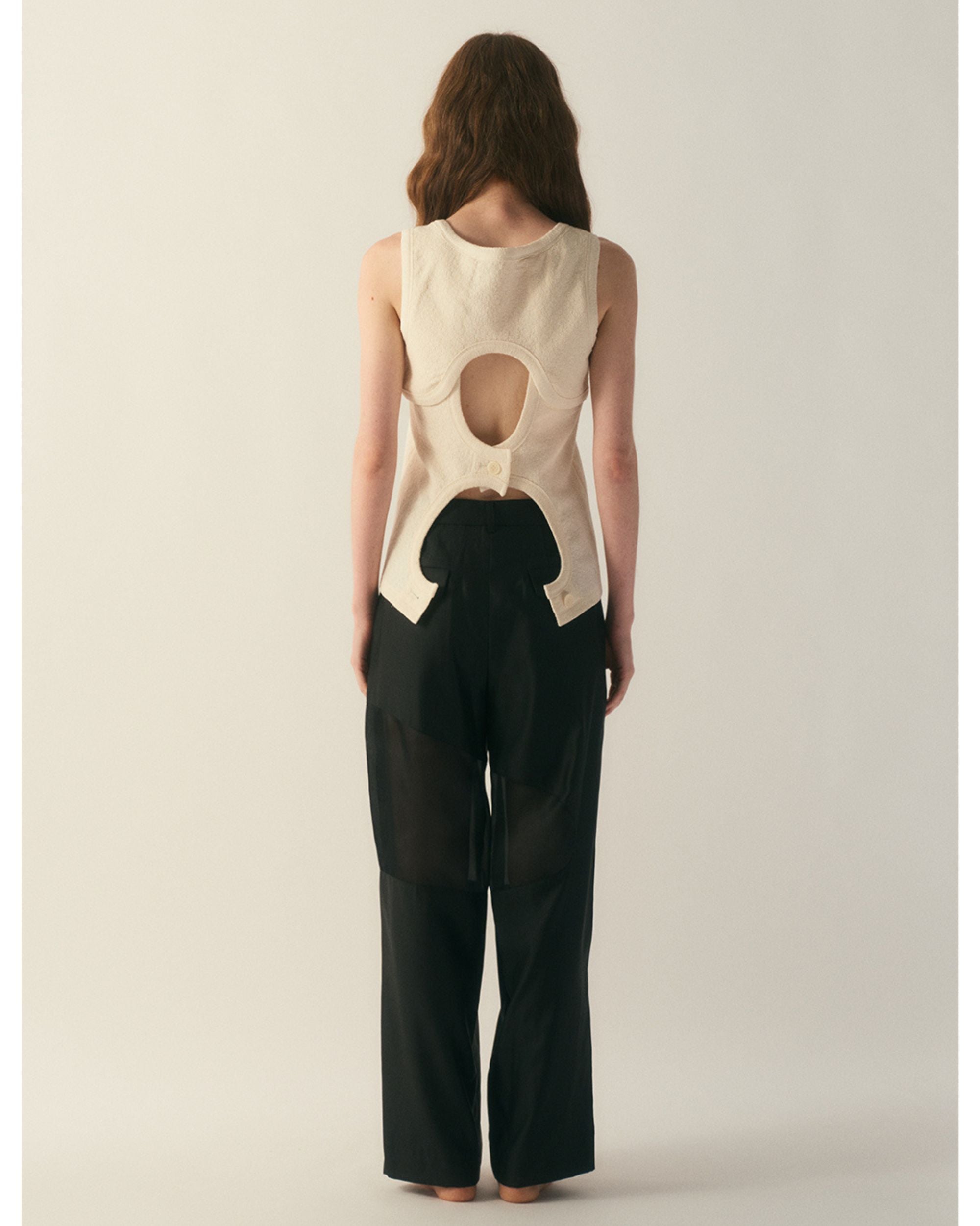 Back view of cream wool silk jersey top with oval back cut-out detail

