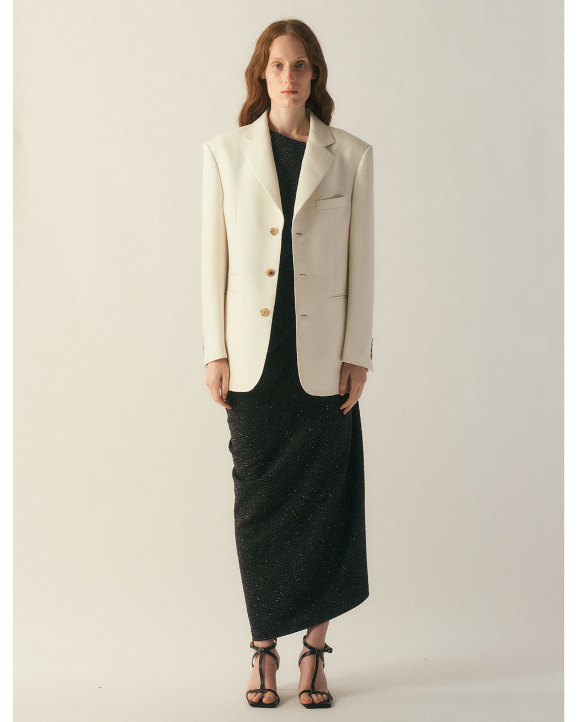 Front view of the Veyra Wool Silk Jacket worn over a black dress
