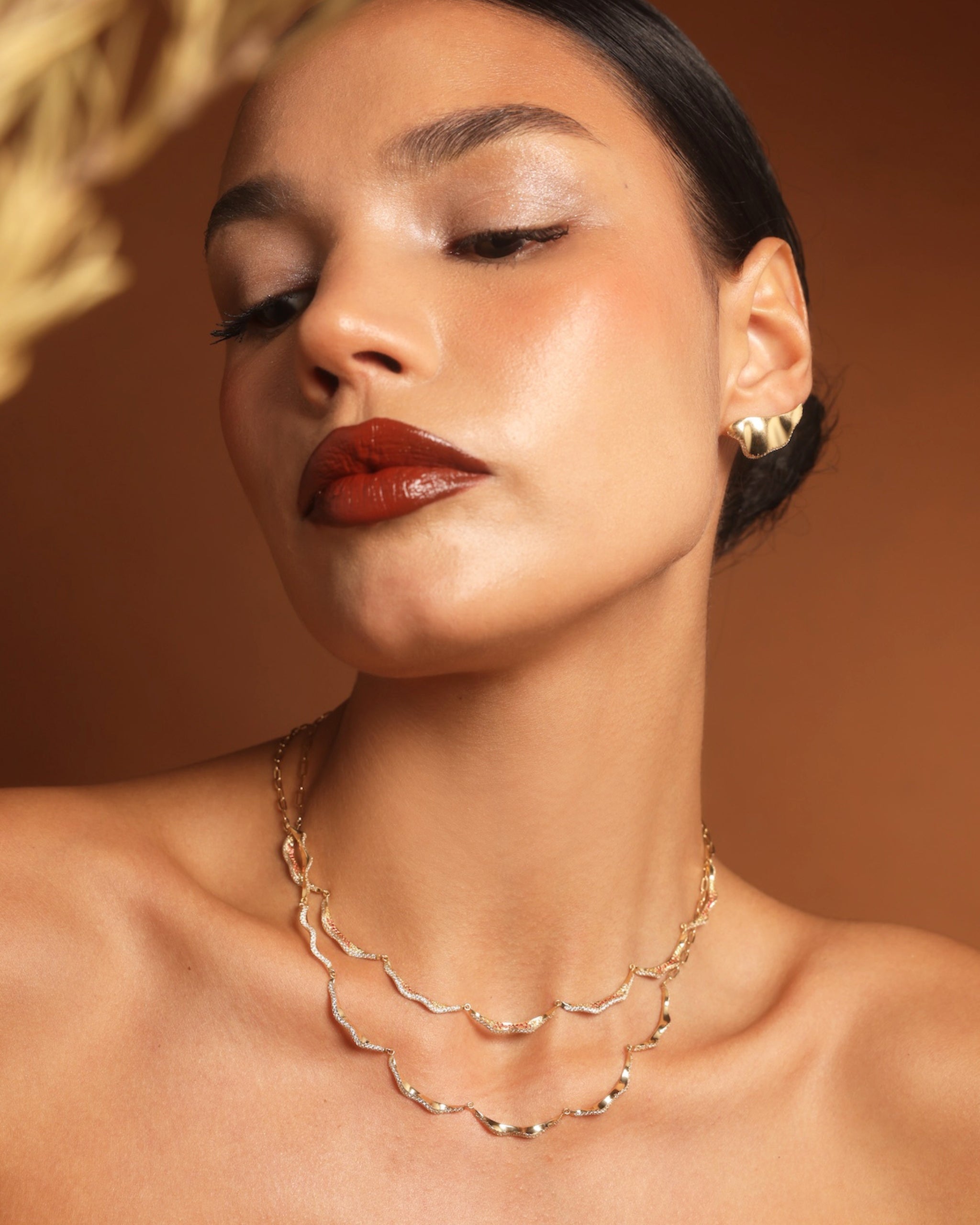 Model wearing the Plain Serene Necklace layered, showing scale and styling.
