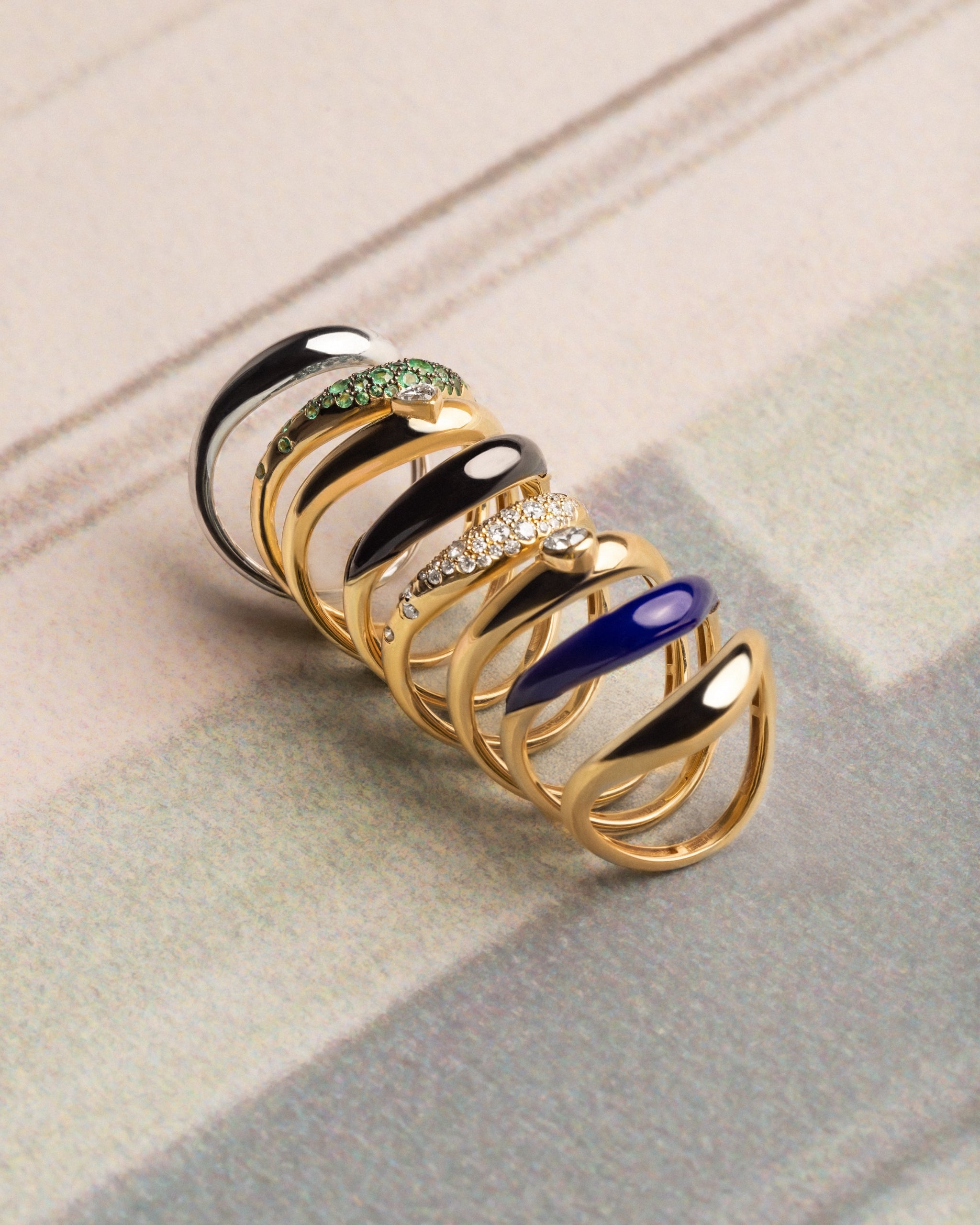 L’Atelier Nawbar Boa Rings — group stack with Black Onyx highlighted