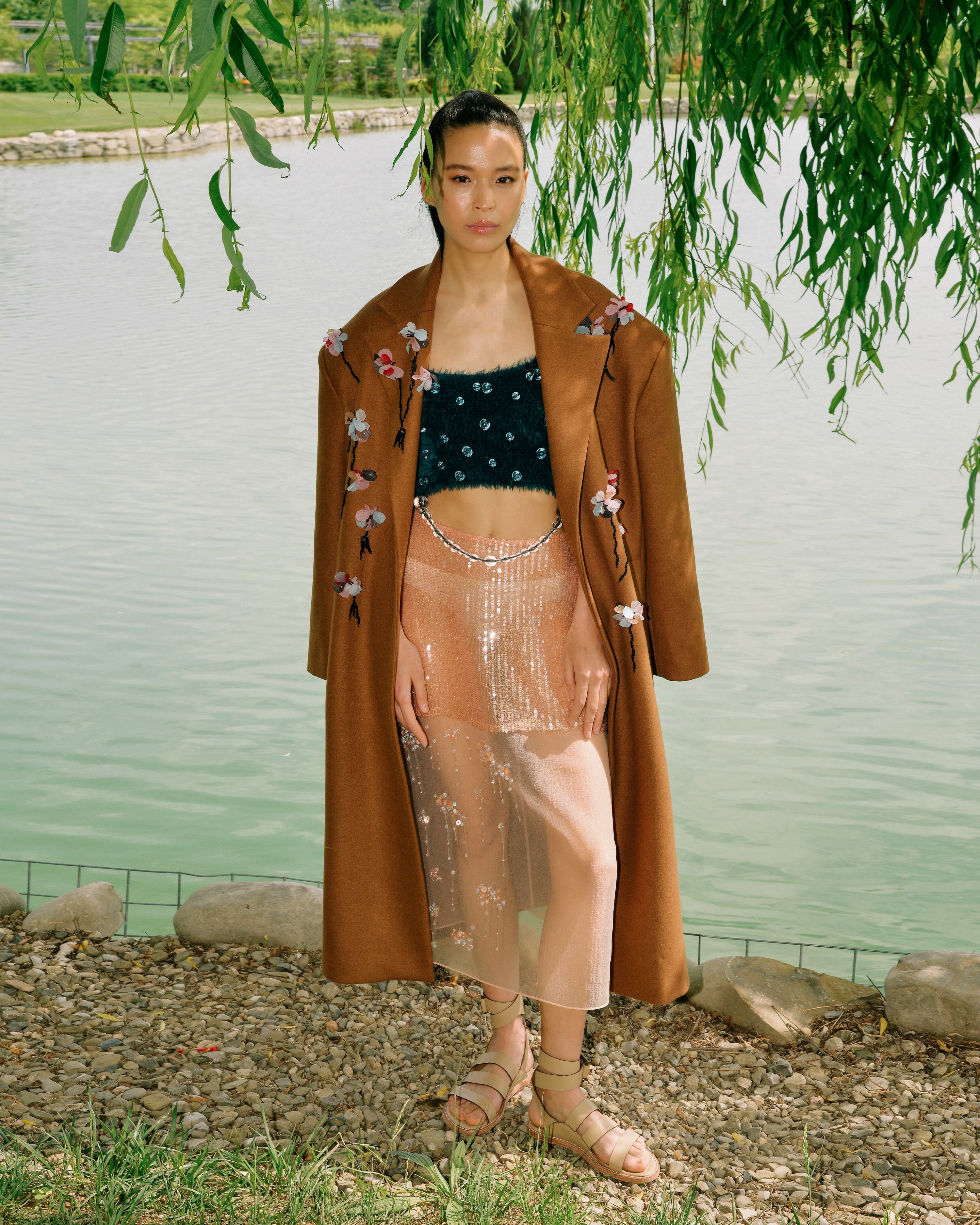 Full-length view of the Floris Coat worn over a matching dress
