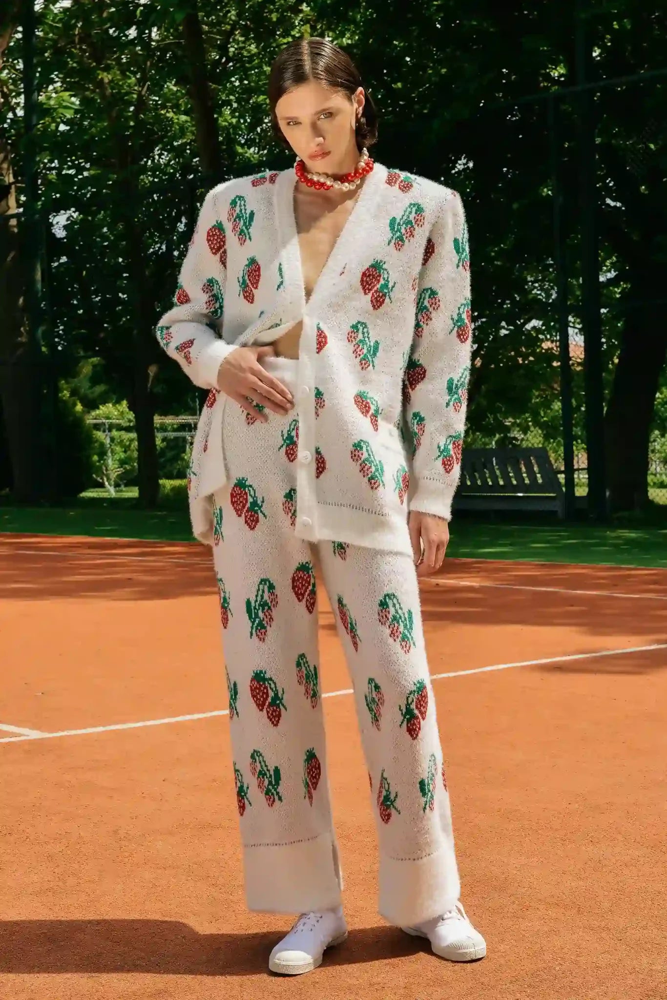 White strawberry knit pants worn on model, straight-leg fit
